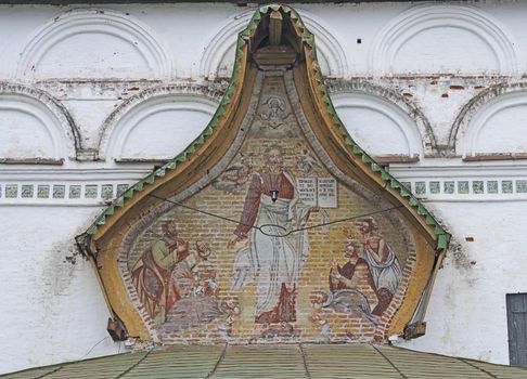 Big fresco on the eastern facade of the temple Demetrios in Dymkovo village, Veliky Ustyug, North Russia