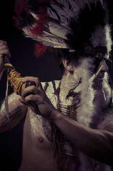 American Indian chief with big feather headdress