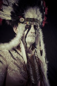 American Indian chief with big feather headdress