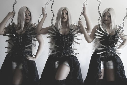 Three beautiful women, clones with gothic black dress