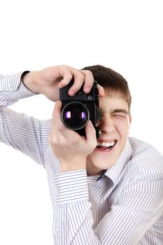 Young Man Take a Picture with Vintage Photo Camera Isolated on the White Background