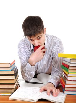 Student preparing for Exam at the School Desk on the White Background