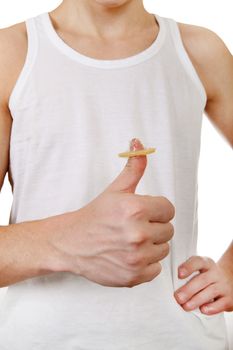 Man holding the Condom on the Thumb and shows OK Gesture closeup