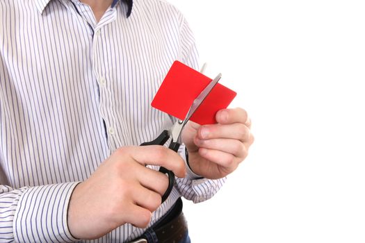 Person cutting a Credit Card Closeup on the White Background