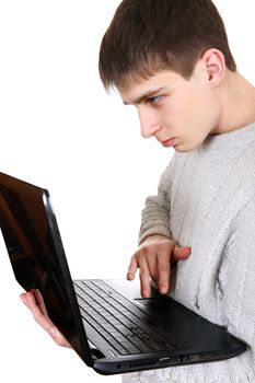 Serious Teenager working on the Laptop Isolated on the White Background