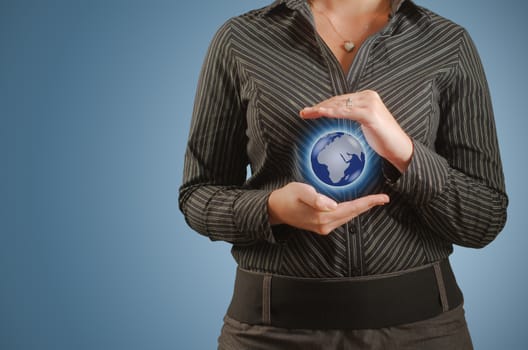 Businesswoman holds or holding world earth in the palm of hand