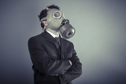 Danger, Business man wearing a gask mask, pollution concept