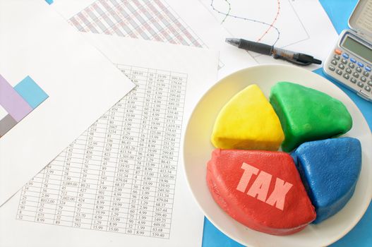 Pie chart cut into slices with one section labeled tax 