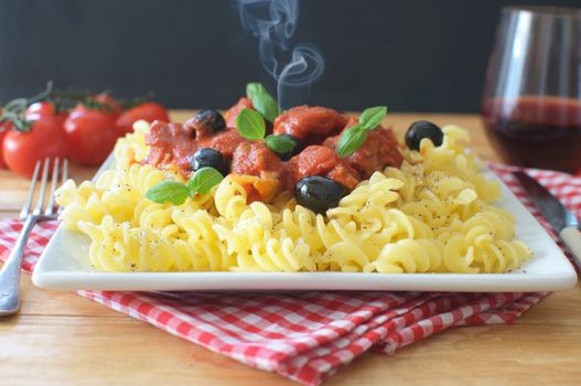 Hot italian pasta with chicken savory tomato sauce 