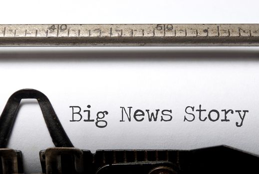 Old typewriter with big news story heading