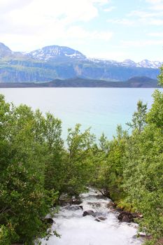View on mouintain river and fjord in northern Norway
