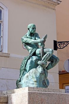 Fisherman with Snake, statue and fountain by Simeon Roksandic (1874-1943) at Jezuitski Square in Zagreb, Croatia