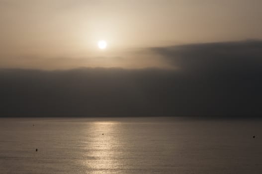 Sunset into cloud cover, La Zenia, Costa Blanca, Spain in July.