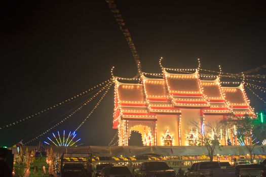 Pagodas and churches at the night in the temple fair,Thailand