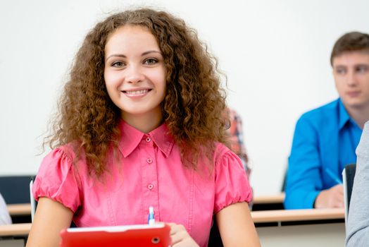 image of a young female student in the classroom, teaching at the University of