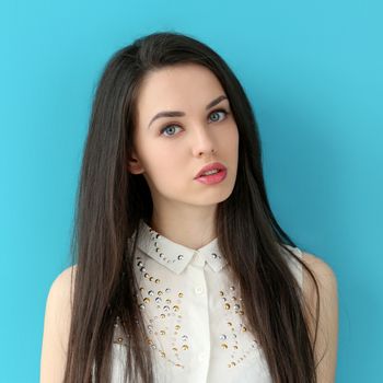 Cute, attractive woman on a blue background