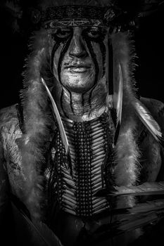 American Indian chief with big feather headdress, warrior