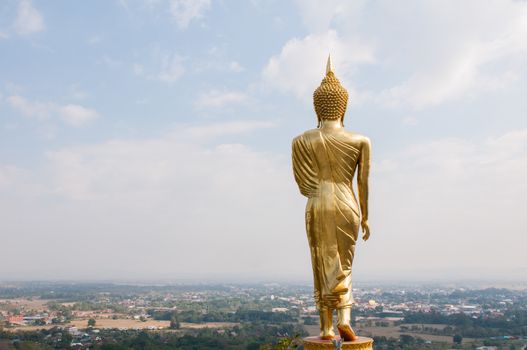 Buddha standing on a mountain Wat Phra That Khao Noi, Nan Province, of Thailand