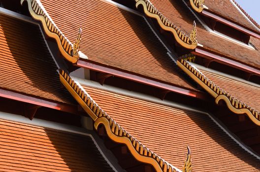 The red tile roof is the architecture of Buddhist temple.It has Naga structure on gable.