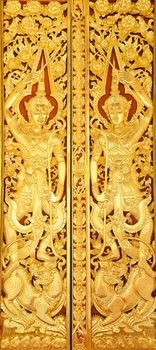 The door of Buddhist temple made from wood that cover with lacquer and gold leaf(or paint).The principle carve the angel sculpture.