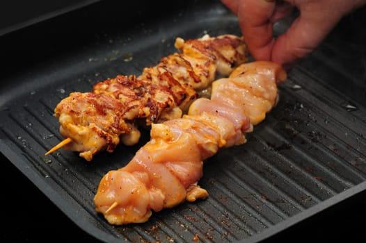 preparation of chicken shish kebab on skewers