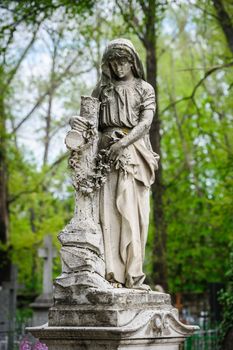 Marble statue on the grave at old catholic cemetery in Chisinau, Moldova