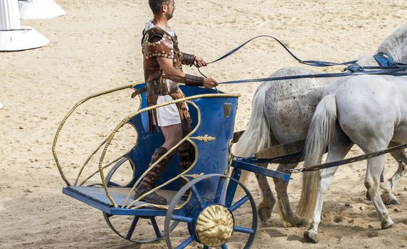 Roman chariot in a fight of gladiators, bloody circus