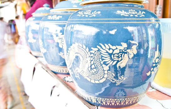 Antique glazed water jar with dragon patterns at home