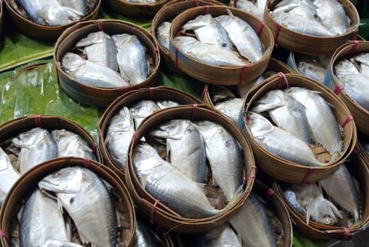 Mackerel fish in bamboo basket at market, Thailand