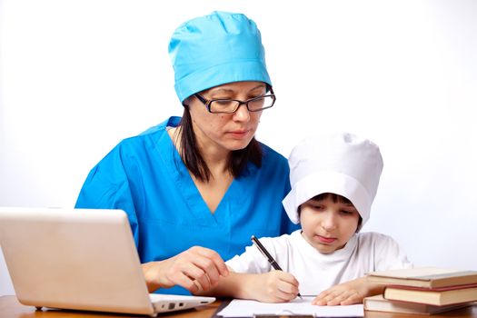 mom and son doctors write prescriptions