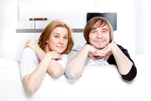 happy couple in the interior of a new home