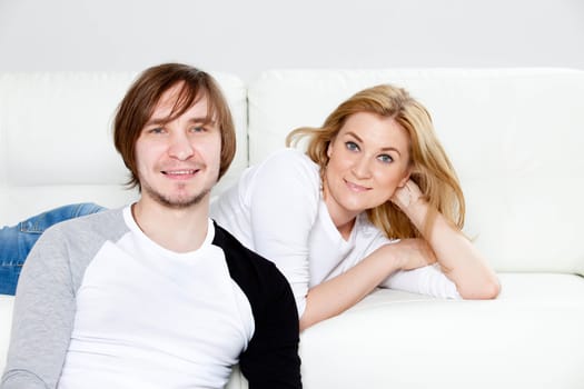 Happy couple relaxing in living room