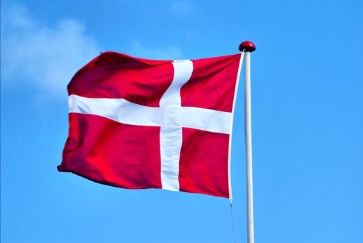 A Danish Flag in the wind. Dannebrog.