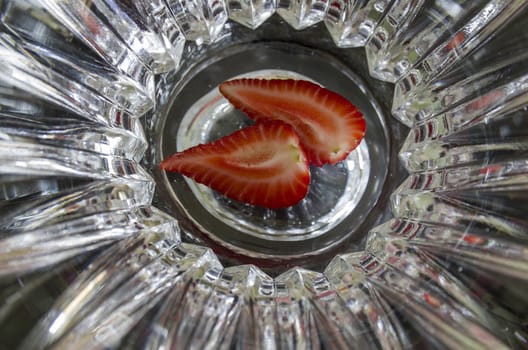 Sectioned fruit: two slices of strawberry