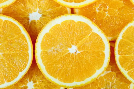 Background made of heap fresh orange slices