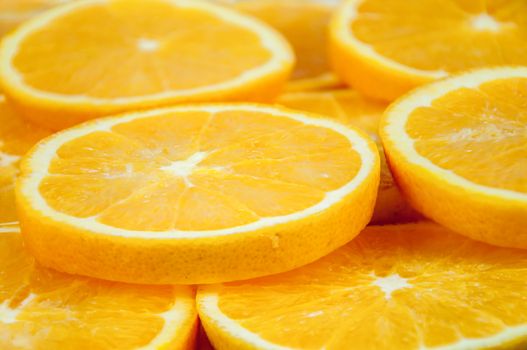 Background made of heap fresh orange slices