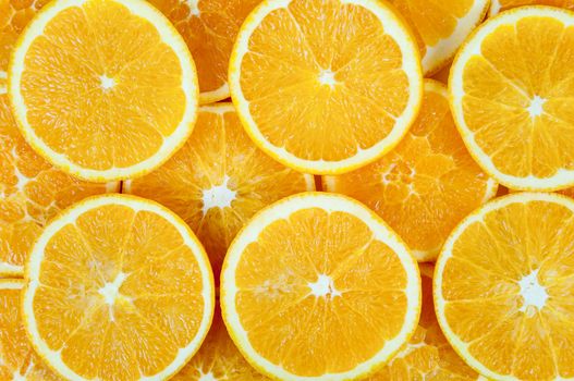 Background made of heap fresh orange slices