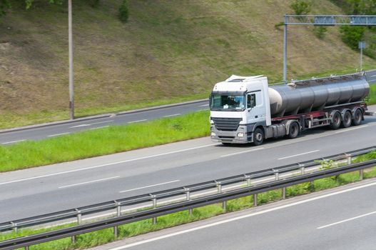 Milk cistern truck on a modern highway