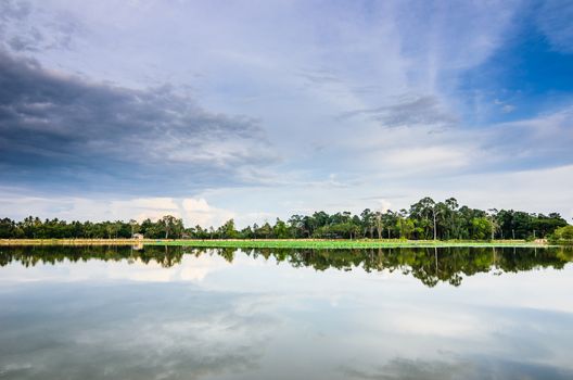 Pond and clouds in spring nature landscape in Thailand