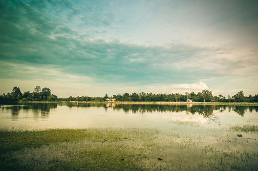 Pond and clouds in spring nature landscape in Thailand