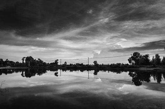 Pond and clouds in spring nature landscape in Thailand