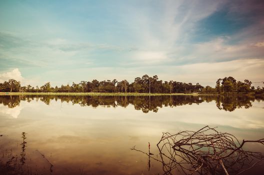 Pond and clouds in spring nature landscape in Thailand