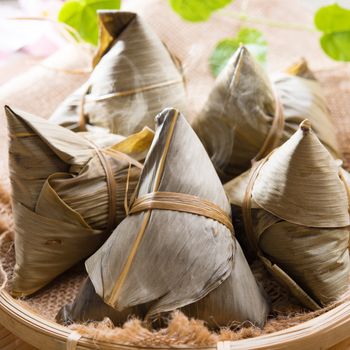 Rice dumpling or zongzi. Traditional steamed sticky glutinous rice dumplings. Chinese food dim sum. Asian cuisine.