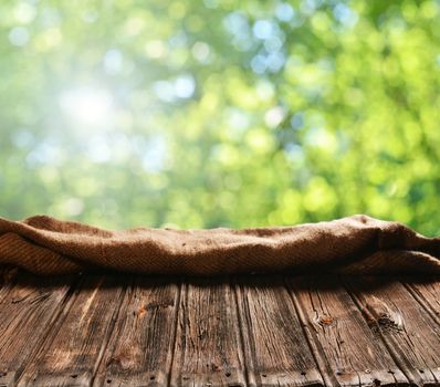 Empty table and defocused fresh green background