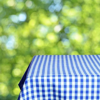 Empty table and defocused fresh green background