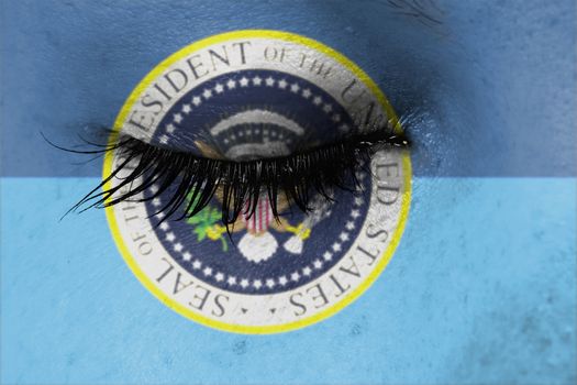 Women eye, close-up, concept of grief, presidential seal