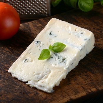 gorgonzola cheese on old wooden background