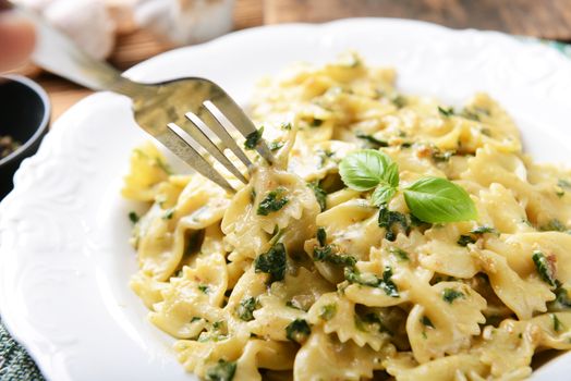 Farfalle pasta with fresh spinach and gorgonzola cheese