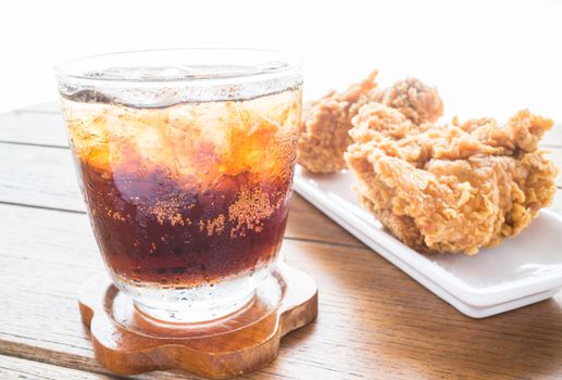 Iced cola drink and fried chicken, stock photo