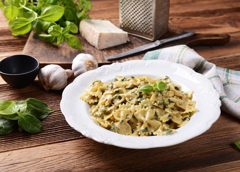Farfalle pasta with fresh spinach and gorgonzola cheese